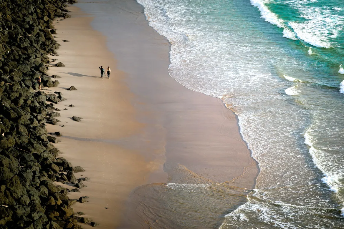 on-the-beach-in-the-rain-karim-ben-van - unsplash
